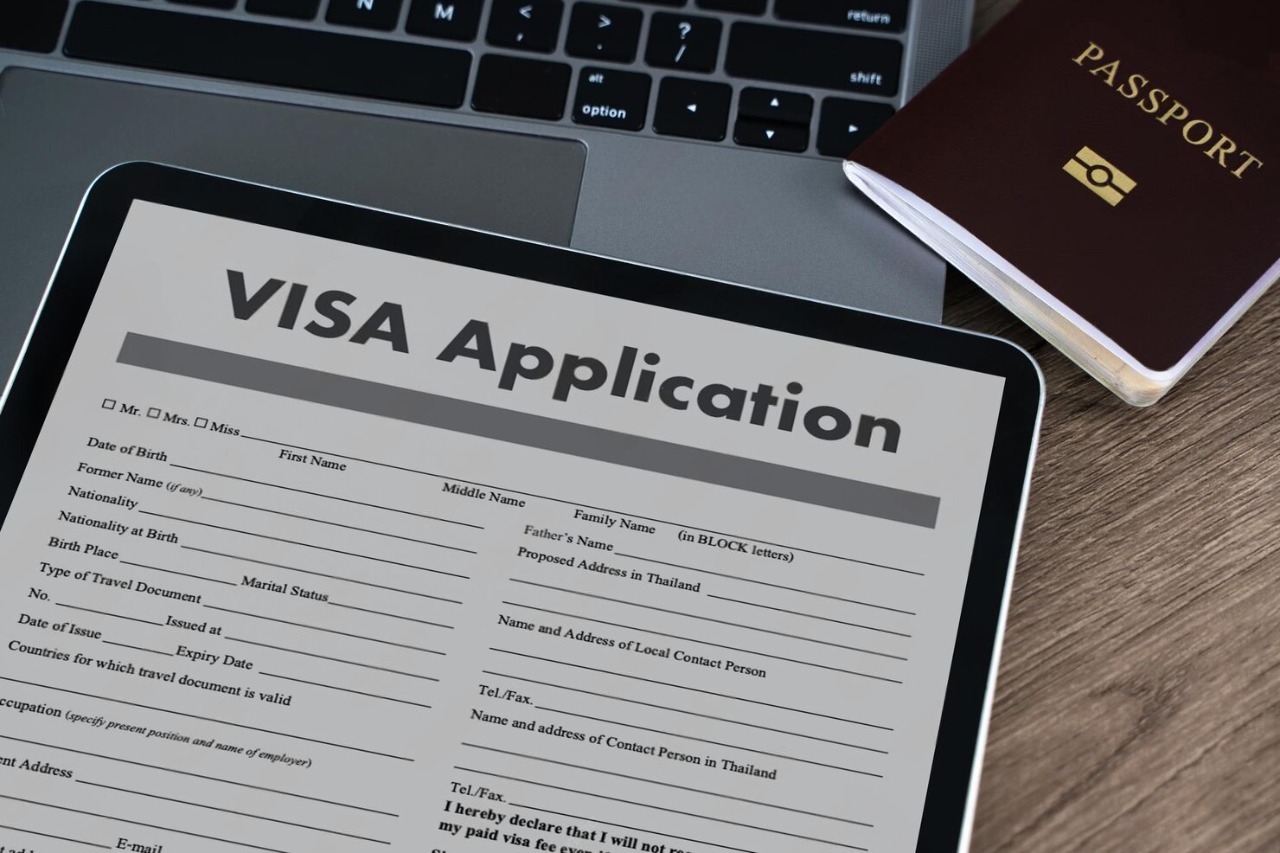 visa-application-digital-tablet-displaying-visa-application-form-placed-wooden-desk-with-passport-laptop-keyboard-background-suggesting_36325-5885